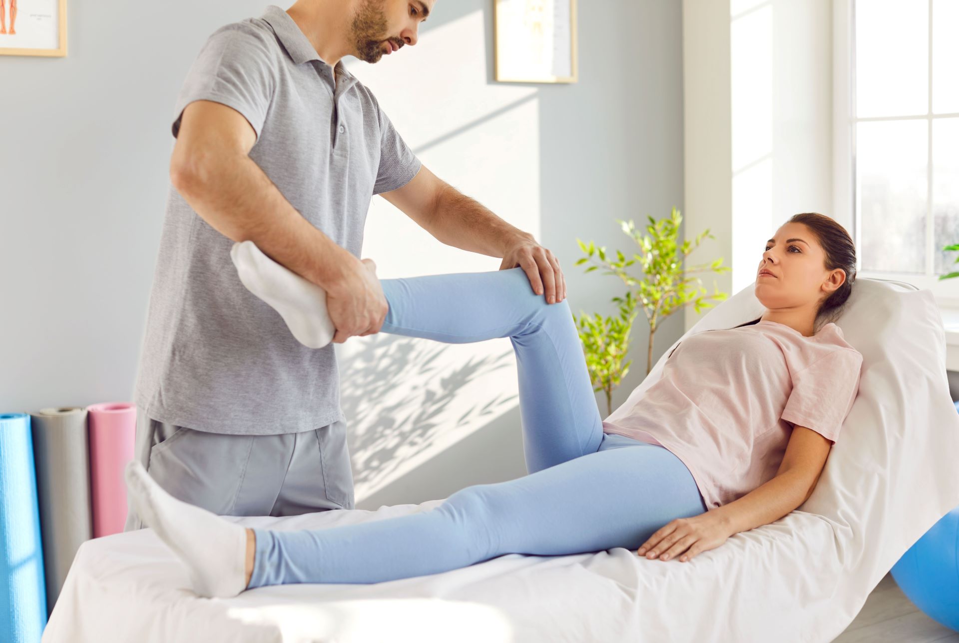 man nurse woman lower limb rehabilitation